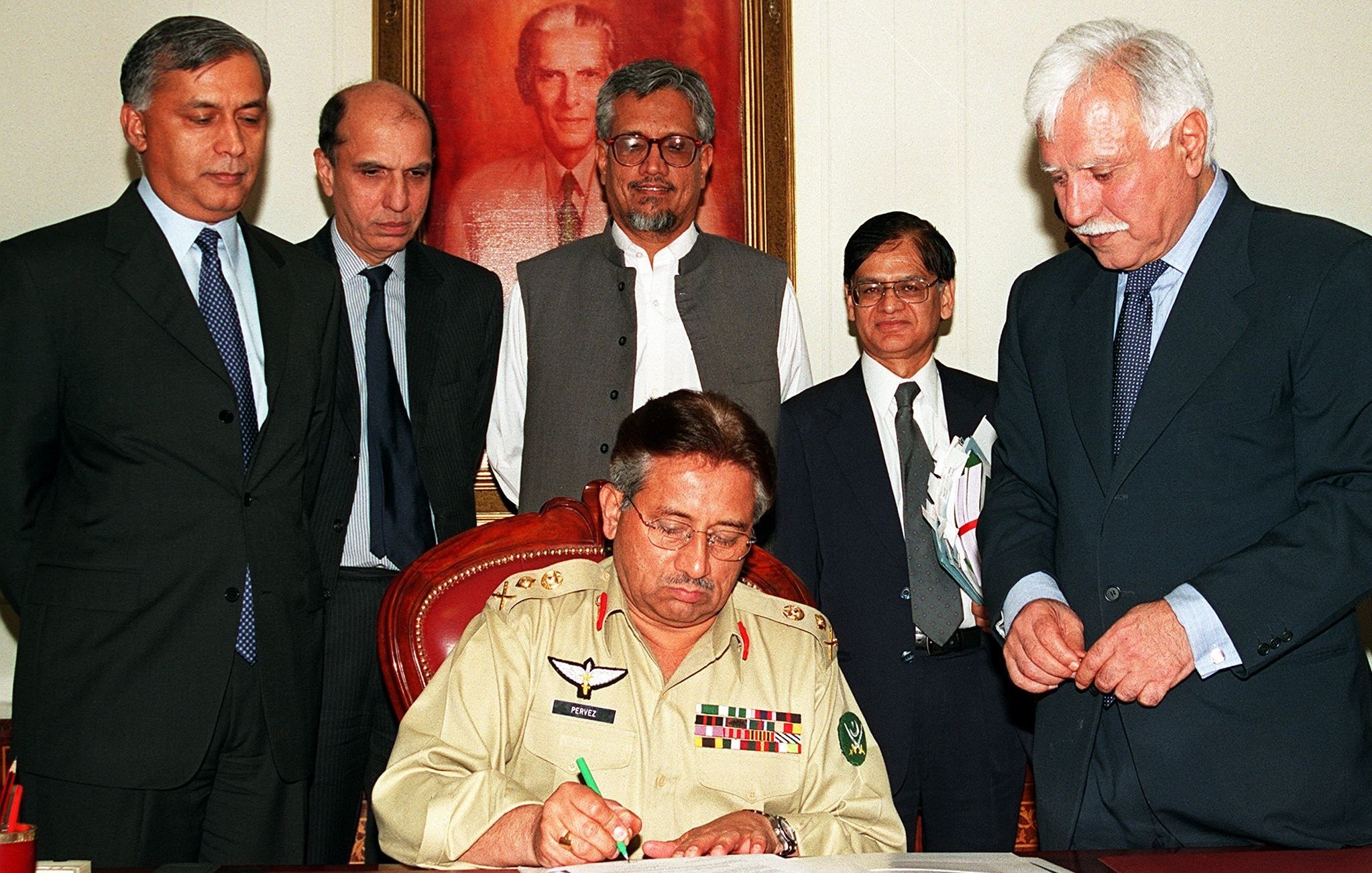 CE General Pervez Musharraf signs the national budget for the year 2001-02 in Islamabad, June 18, 2001.